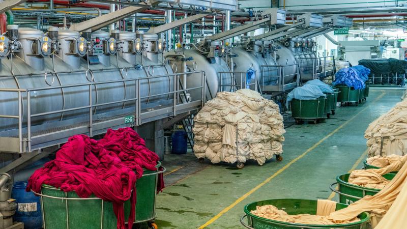 Textile dyeing process with vivid colors in Chattogram, Bangladesh.