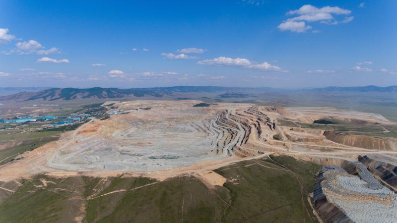 Open-pit mining site showing environmental impact in Mongolia.